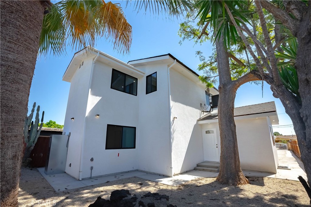 13003 Kamloops Street Pacoima, CA 91331 - Photo 61 of 66 a view of a house with a palm tree