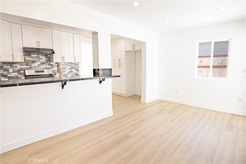 13003 Kamloops Street Pacoima, CA 91331 - Photo 10 of 66 a view of a kitchen with wooden floor