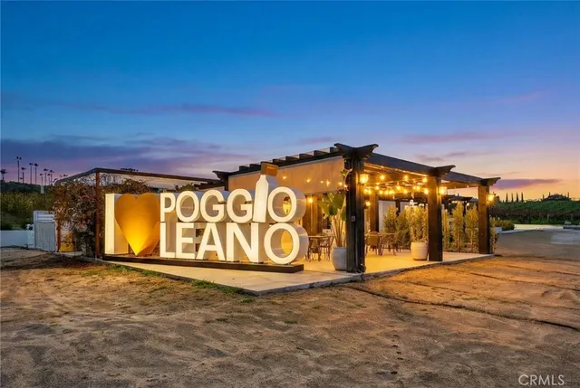 a view of a house with outdoor space and sitting area