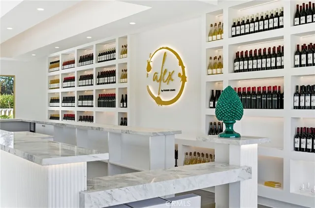 a view of a kitchen with a fridge and a clock on the wall
