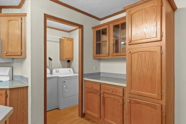 a kitchen with a refrigerator a sink and cabinets