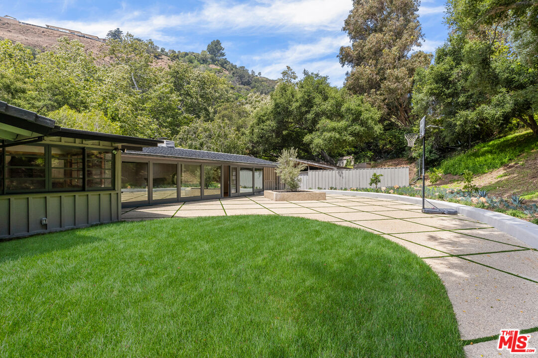 1776 Old Ranch Road Los Angeles, CA 90049 - Photo 15 of 20 a view of a house with backyard and sitting area