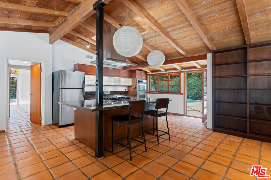 1776 Old Ranch Road Los Angeles, CA 90049 - Photo 3 of 20 a view of a dining room with furniture window and outside view