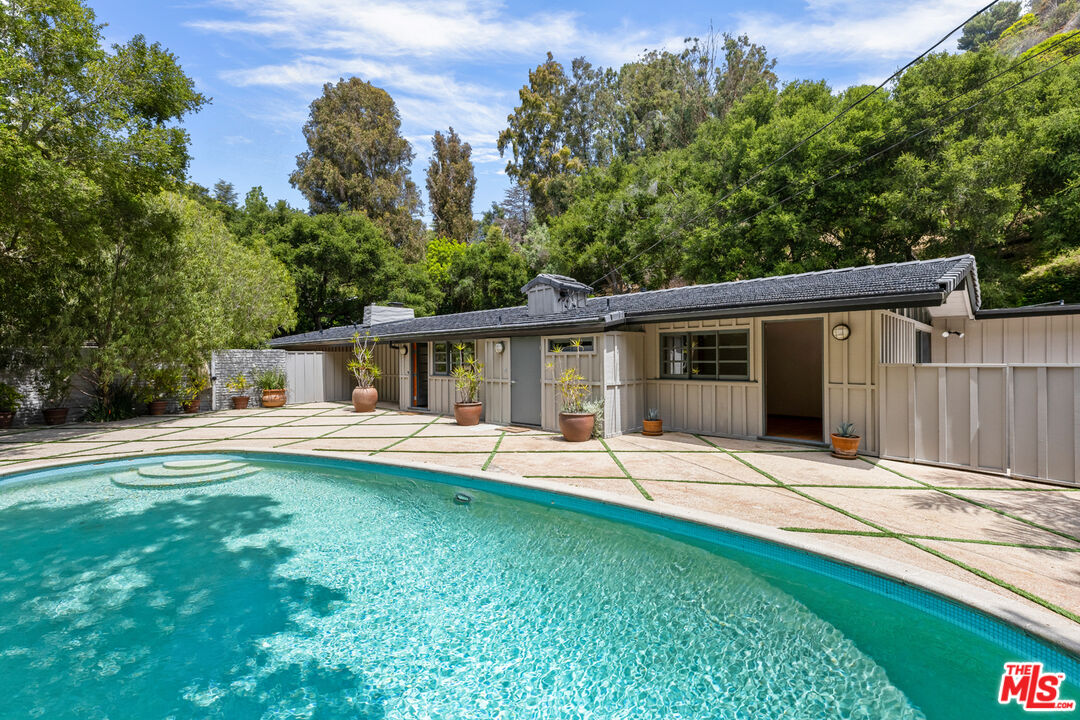 1776 Old Ranch Road Los Angeles, CA 90049 - Photo 10 of 20 a front view of a house with a yard