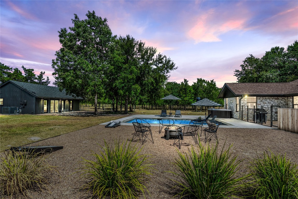 10226 Parsons Road Manor, TX 78653 - Photo 17 of 22 a view of a house with pool and sitting area