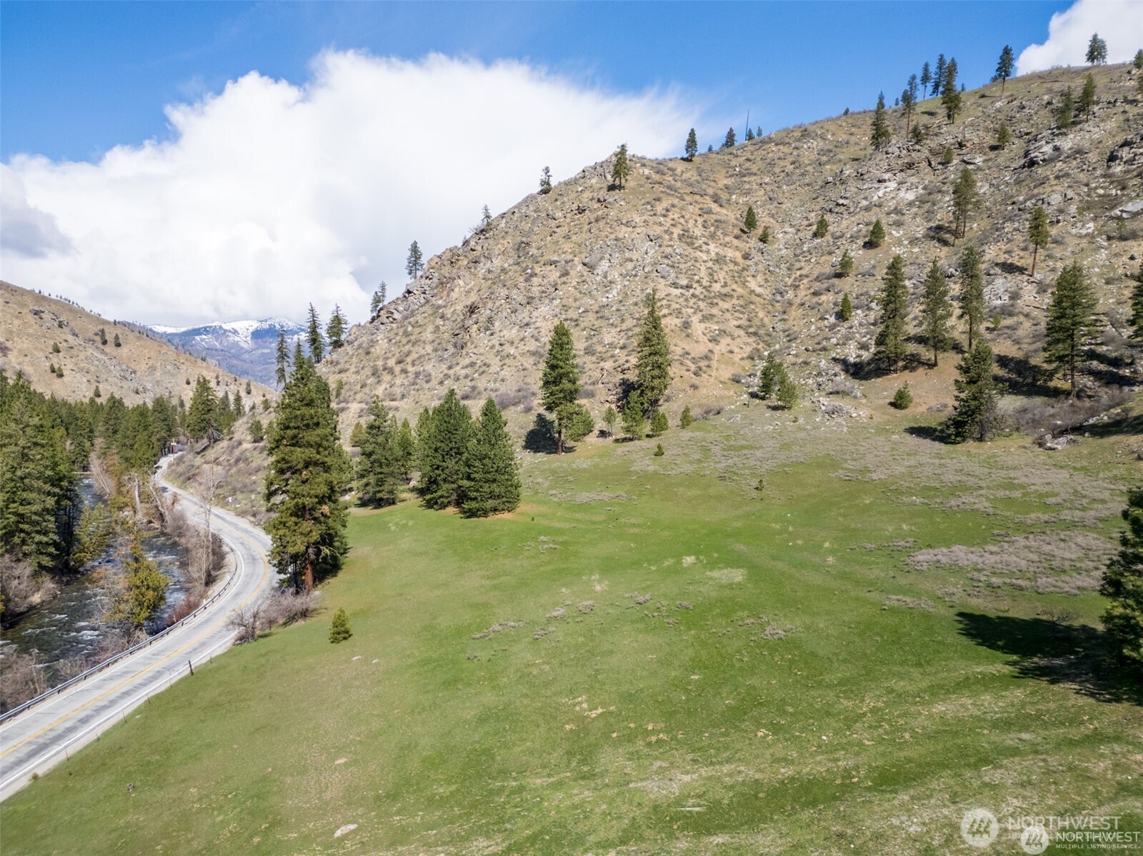 12 Entiat River Road Entiat, WA 98822 - Photo 2 of 22 a view of a building with mountains in the background