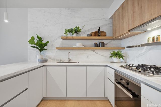 a bathroom with a sink and mirror