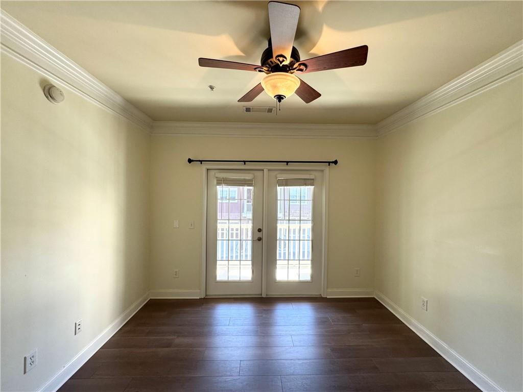 621 Perimeter Walk Atlanta, GA 30338 - Photo 11 of 20 a view of an empty room with window and wooden floor