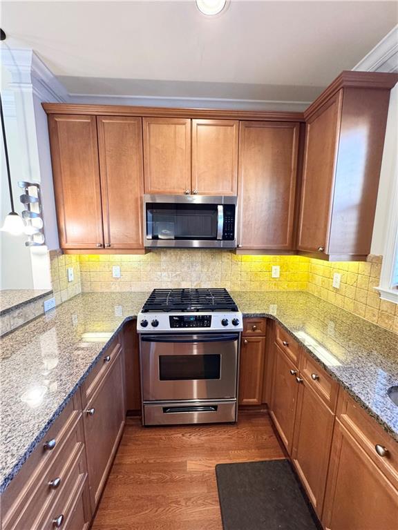 621 Perimeter Walk Atlanta, GA 30338 - Photo 6 of 20 a kitchen with stainless steel appliances granite countertop a stove a sink and a microwave