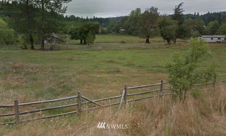 11010 Renton Issaquah Road Southeast Issaquah, WA 98027 - Photo 1 of 1 a view of a field with trees in the background