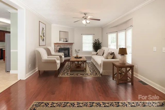 wooden floor in an empty room with a fireplace