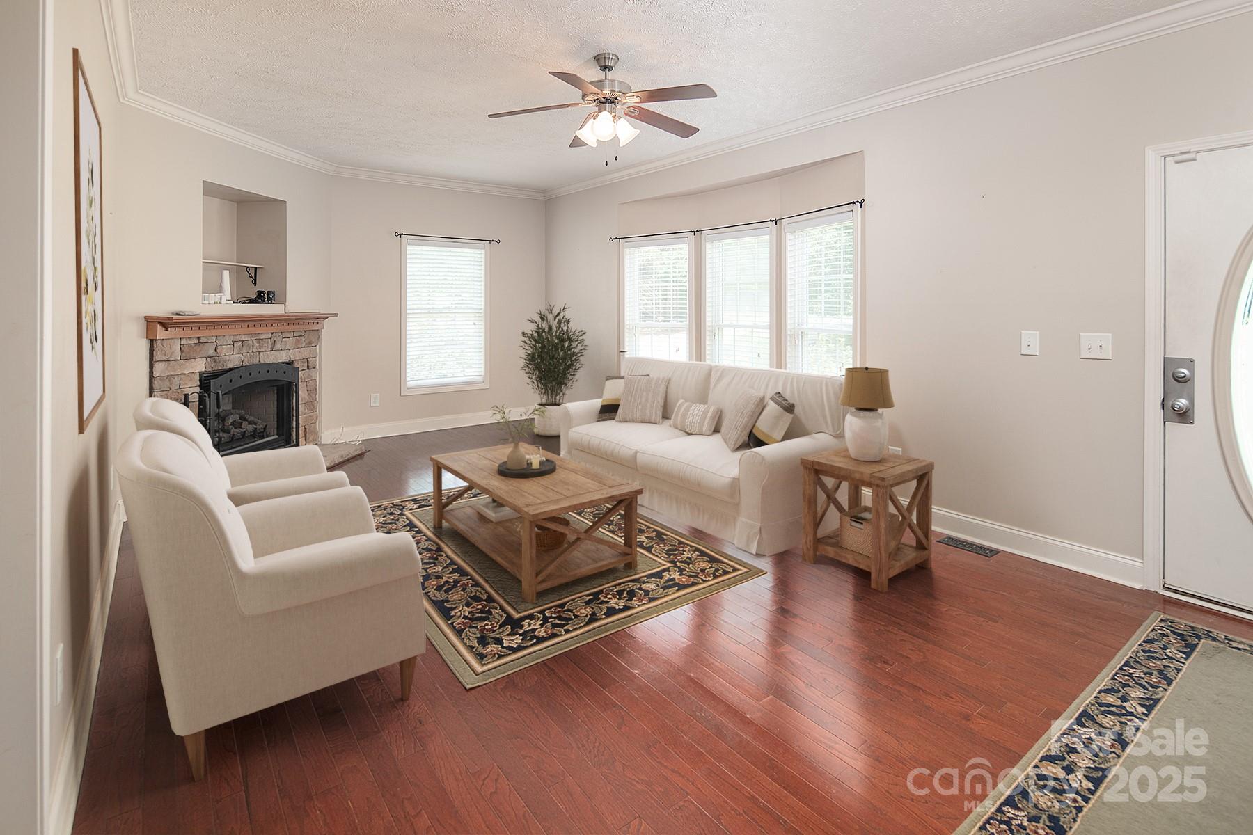 366 Lakehurst Farm Road Norwood, NC 28128 - Photo 18 of 46 a living room with furniture and a fireplace