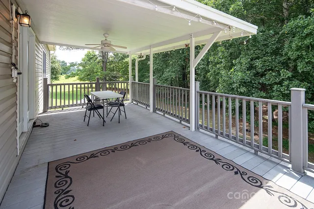 a bedroom with a large bed and a potted plant