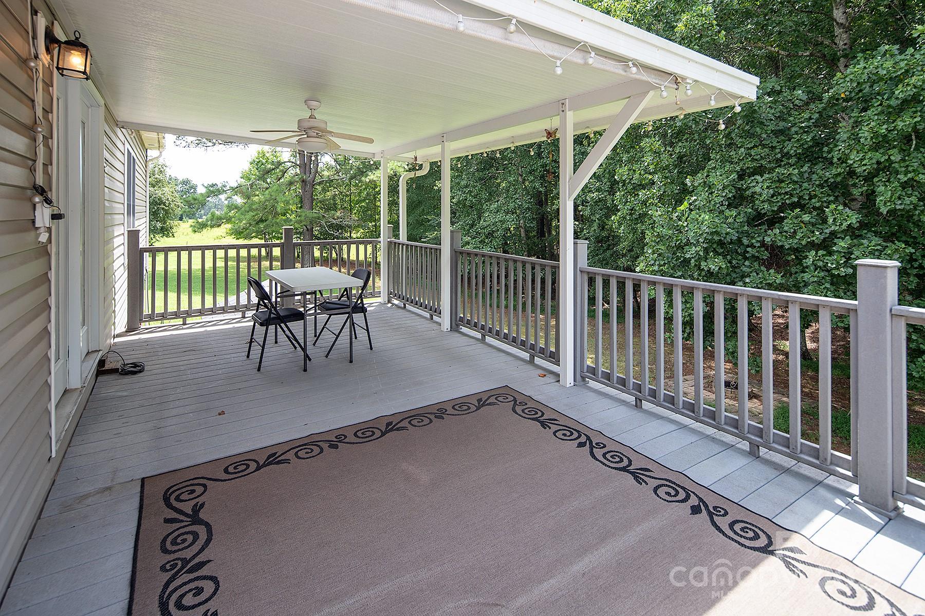 366 Lakehurst Farm Road Norwood, NC 28128 - Photo 21 of 46 a view of balcony with furniture and wooden deck
