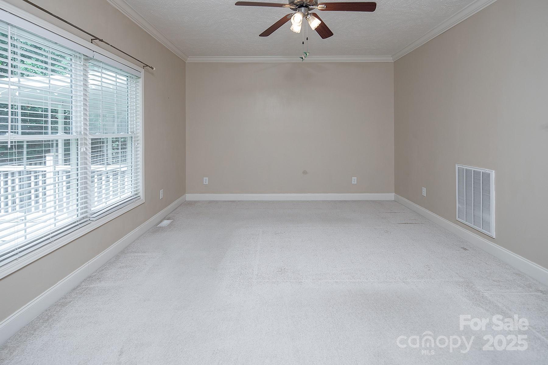 366 Lakehurst Farm Road Norwood, NC 28128 - Photo 23 of 46 an empty room with a empty space and windows