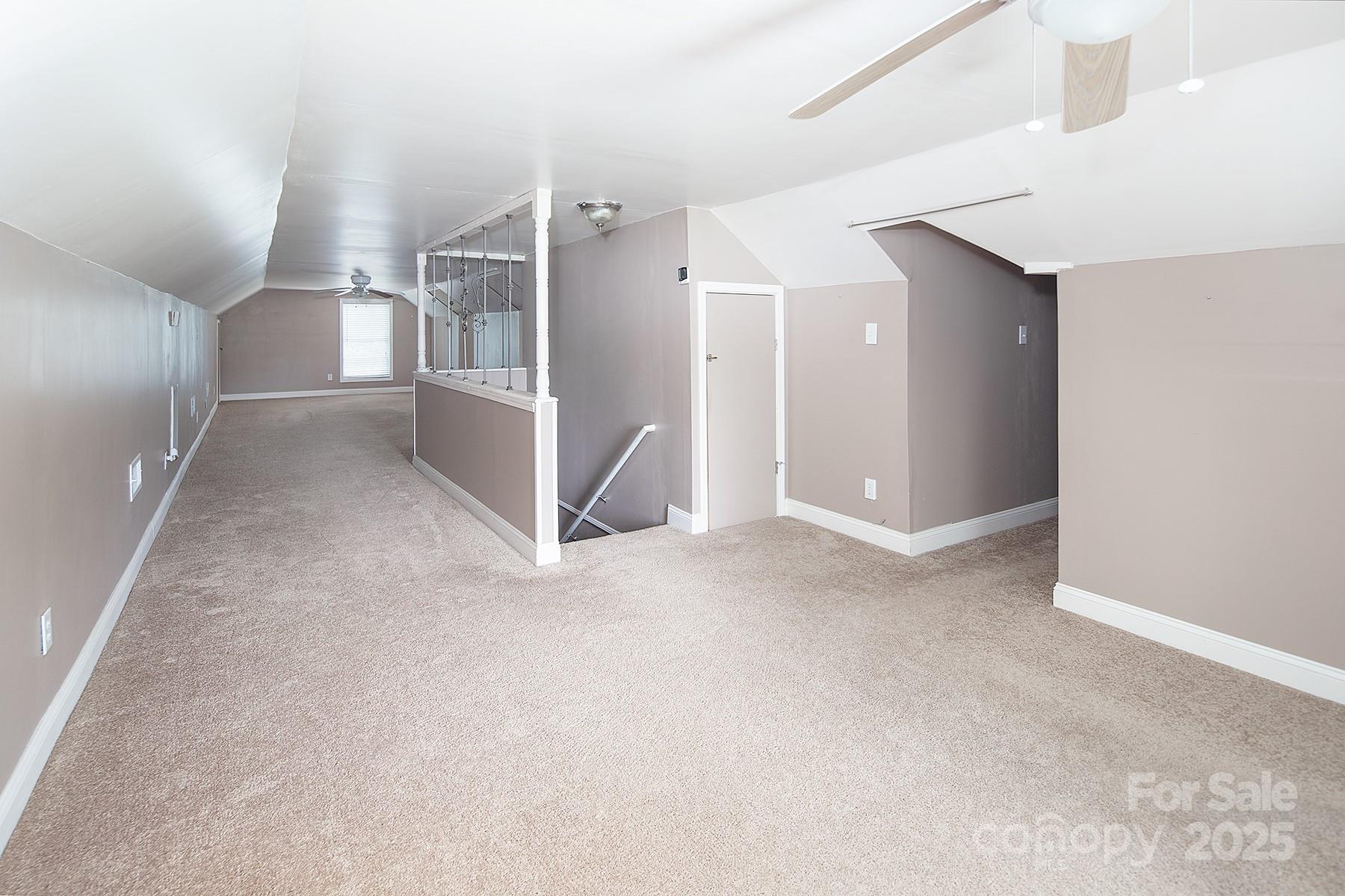 366 Lakehurst Farm Road Norwood, NC 28128 - Photo 32 of 46 a view of a hallway with staircase