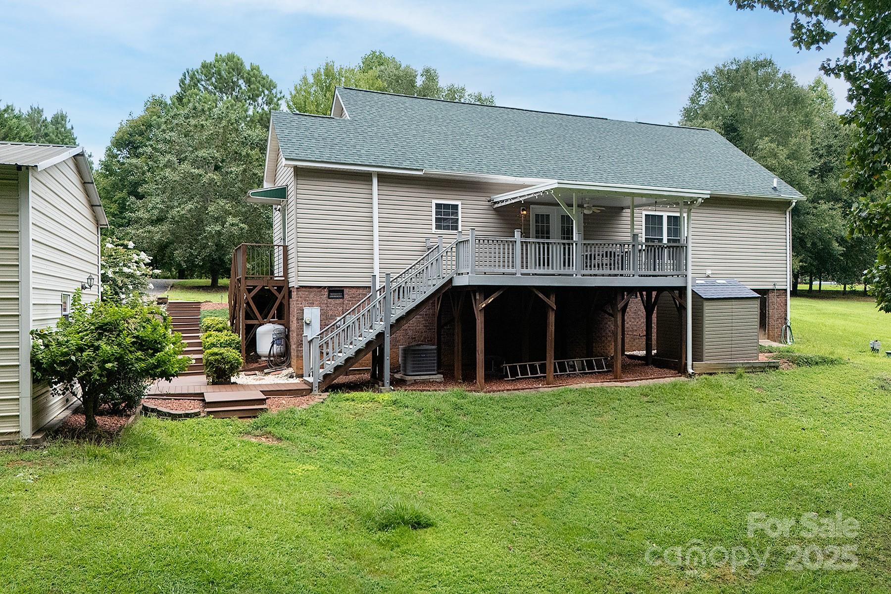 366 Lakehurst Farm Road Norwood, NC 28128 - Photo 38 of 46 a front view of a house with a garden
