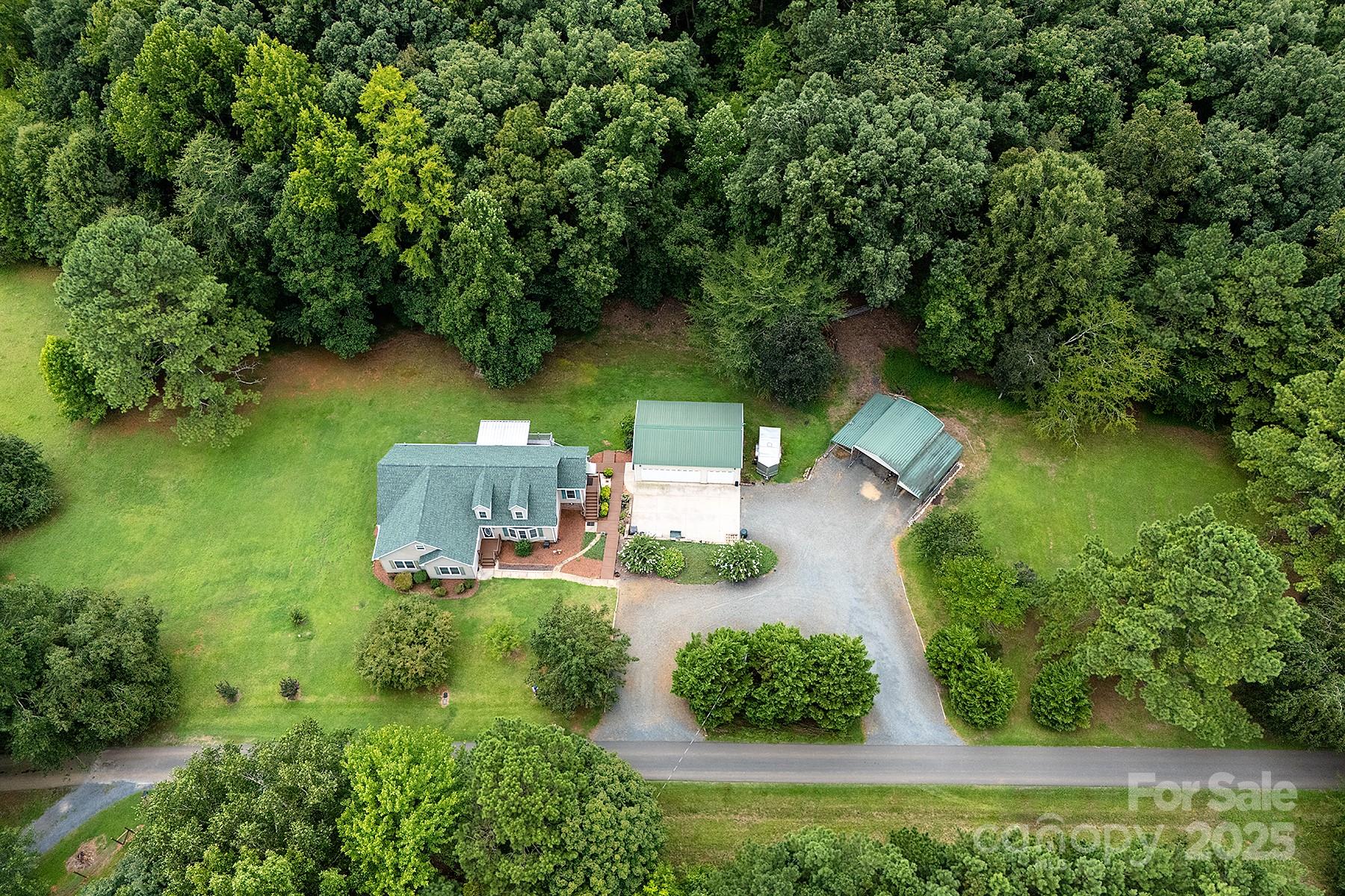 366 Lakehurst Farm Road Norwood, NC 28128 - Photo 4 of 46 an aerial view of a house with a yard