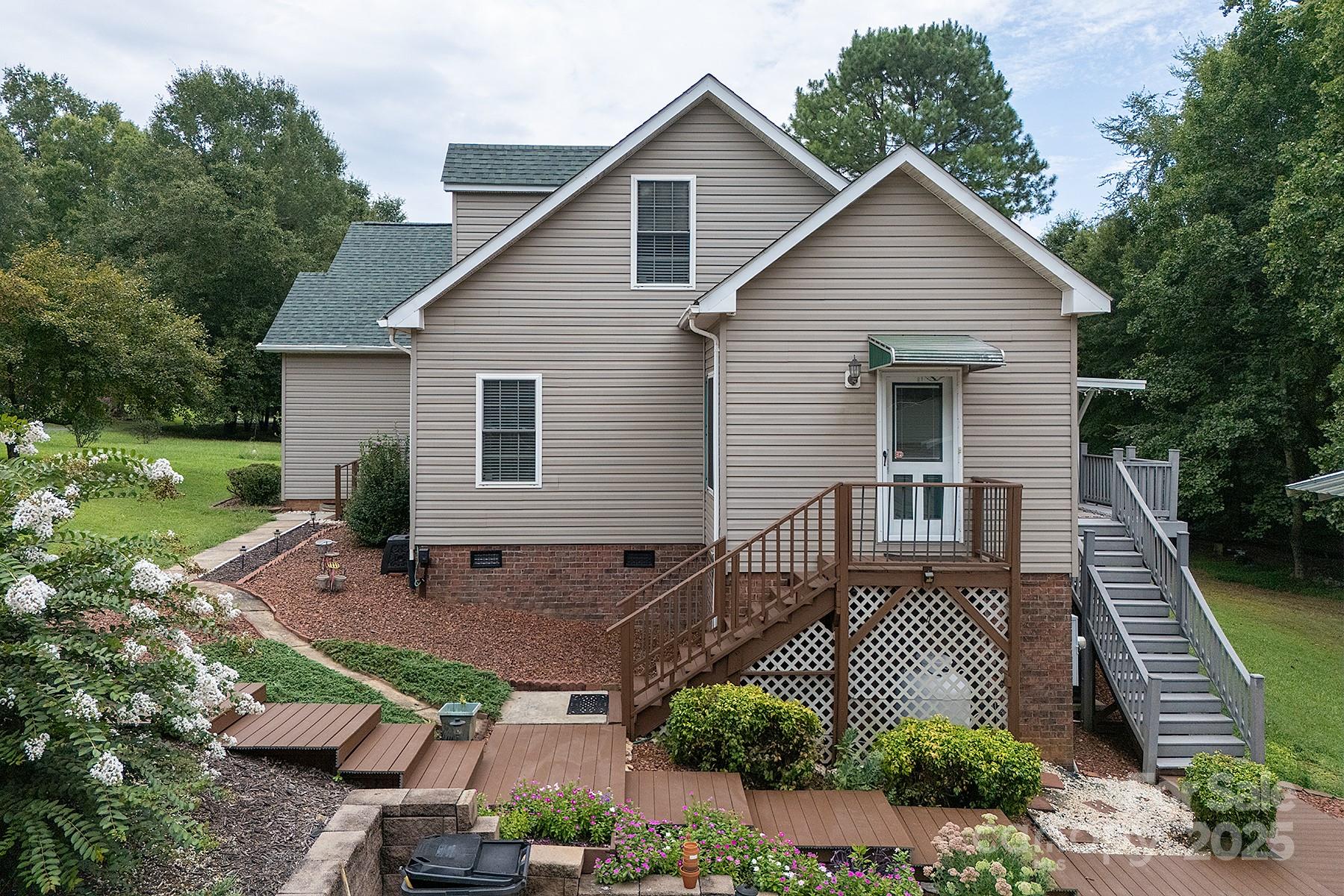 366 Lakehurst Farm Road Norwood, NC 28128 - Photo 5 of 46 a view of a house with a yard