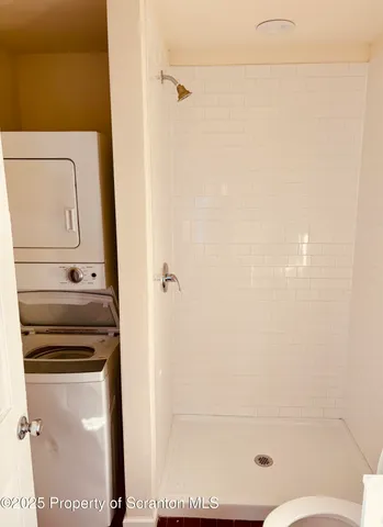 a kitchen with a refrigerator and a stove