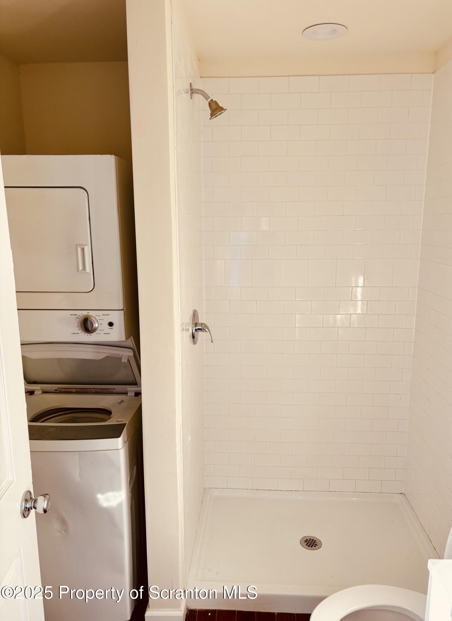 3709 Laurel Avenue, Unit REAR 2 Moosic, PA 18507 - Photo 7 of 12 a bathroom with a shower toilet and sink