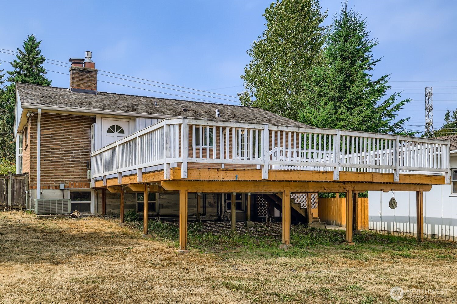 23001 Brier Road Brier, WA 98036 - Photo 28 of 28 a roof deck with table and chairs a barbeque