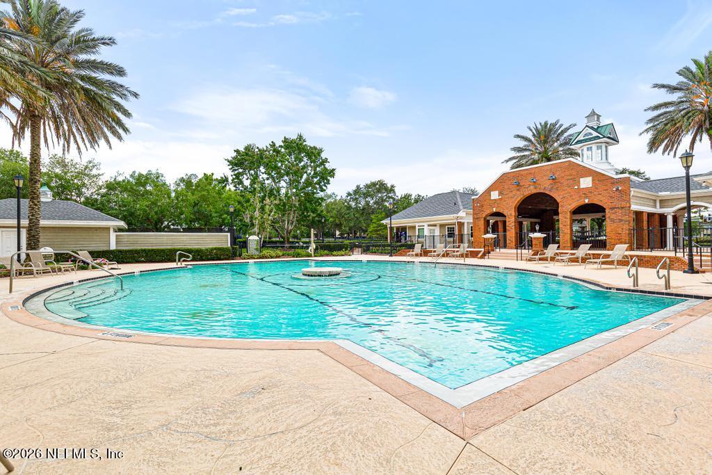 7843 Mt Ranier Drive Jacksonville, FL 32256 - Photo 103 of 116 a view of a swimming pool with a garden