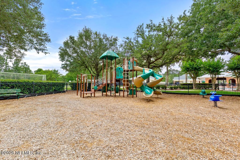 7843 Mt Ranier Drive Jacksonville, FL 32256 - Photo 106 of 116 a view of a park with swings and slides
