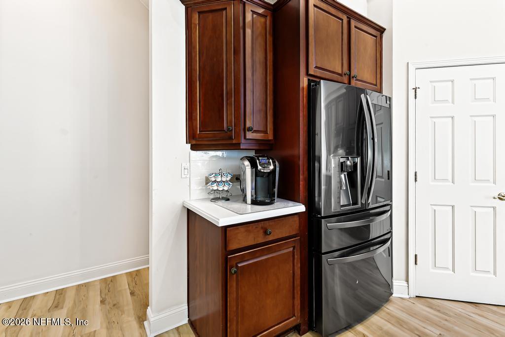 7843 Mt Ranier Drive Jacksonville, FL 32256 - Photo 28 of 116 a kitchen with stainless steel appliances a refrigerator and cabinets
