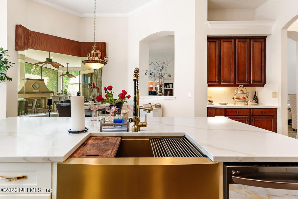 7843 Mt Ranier Drive Jacksonville, FL 32256 - Photo 35 of 116 a kitchen with counter top space cabinets and outdoor space
