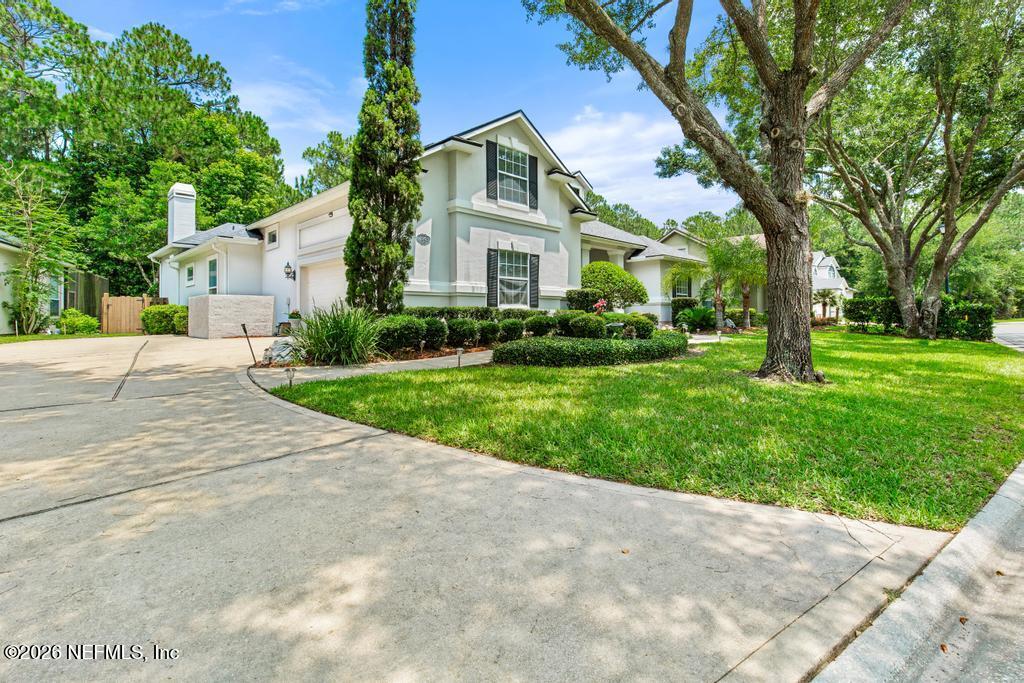 7843 Mt Ranier Drive Jacksonville, FL 32256 - Photo 4 of 116 a front view of house with yard and green space