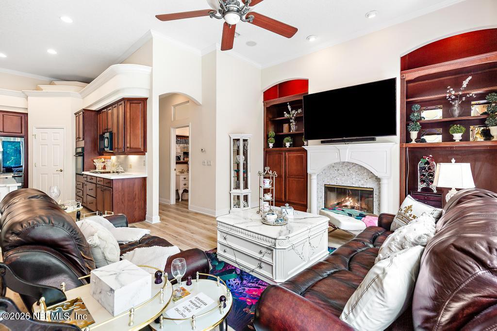 7843 Mt Ranier Drive Jacksonville, FL 32256 - Photo 42 of 116 a living room with furniture fireplace and flat screen tv