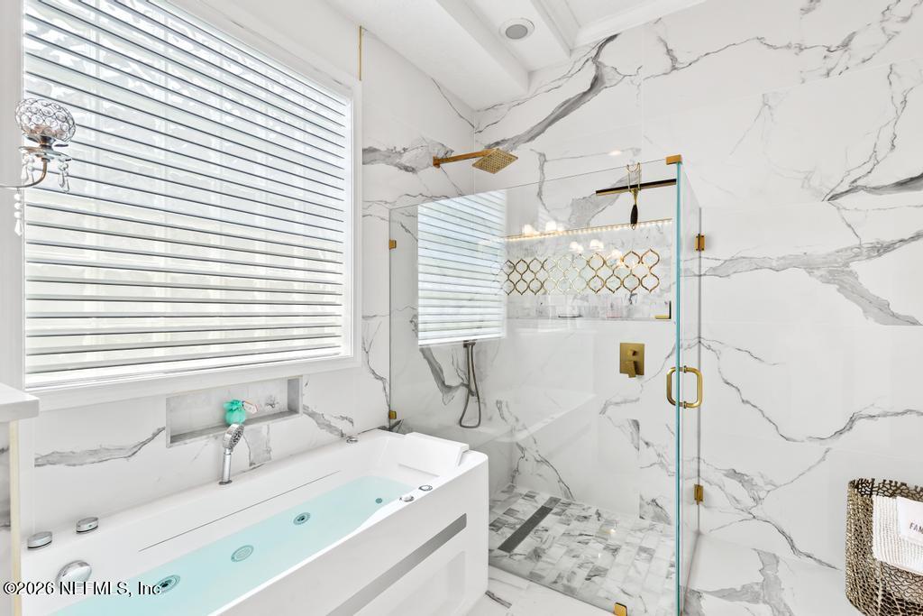 7843 Mt Ranier Drive Jacksonville, FL 32256 - Photo 57 of 116 a bathroom with a granite countertop sink and a bathtub