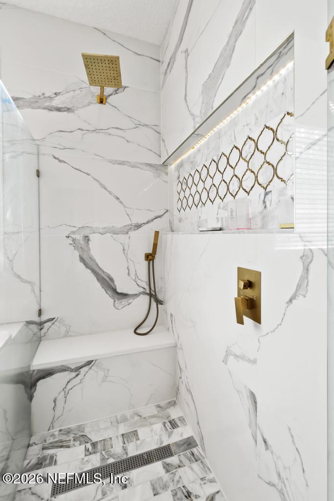 7843 Mt Ranier Drive Jacksonville, FL 32256 - Photo 59 of 116 a bathroom with a sink and a mirror