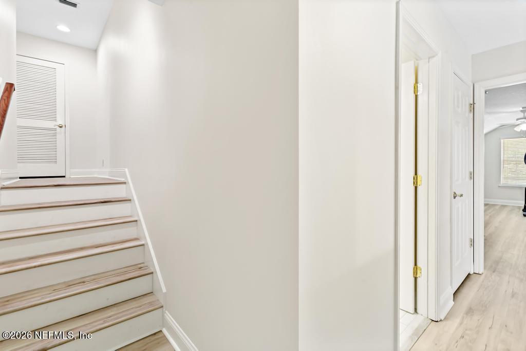 7843 Mt Ranier Drive Jacksonville, FL 32256 - Photo 70 of 116 a view of staircase with white walls