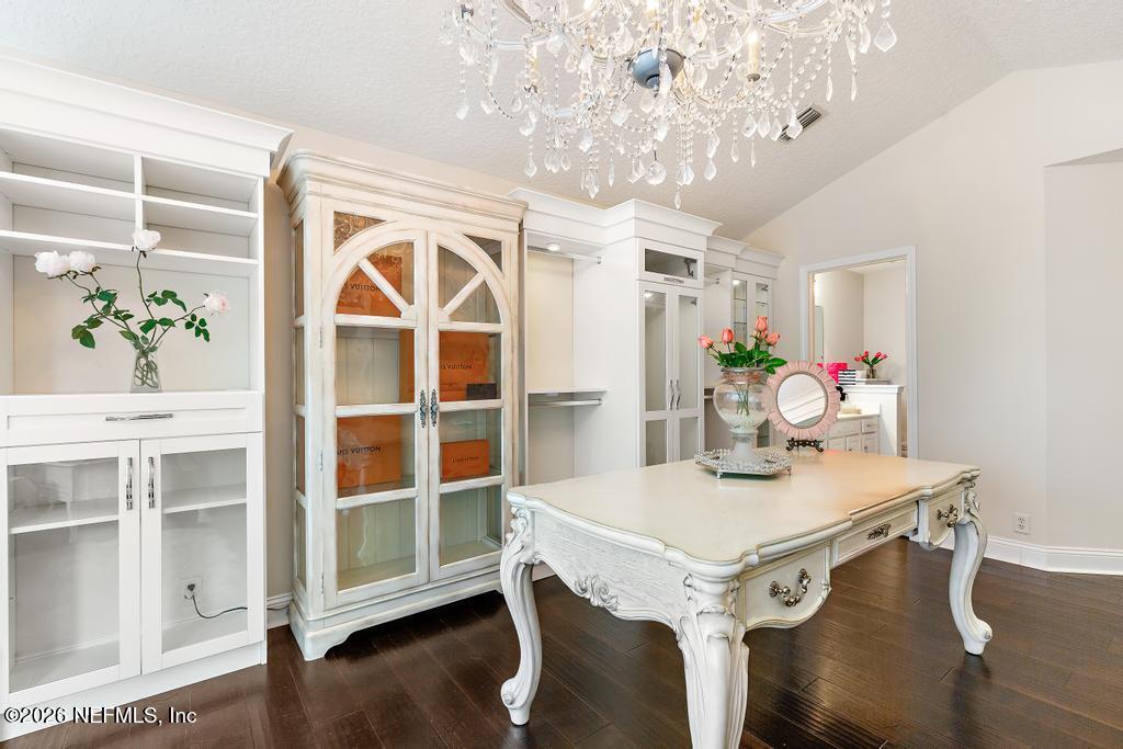 7843 Mt Ranier Drive Jacksonville, FL 32256 - Photo 76 of 116 a view of a dining room with furniture and wooden floor