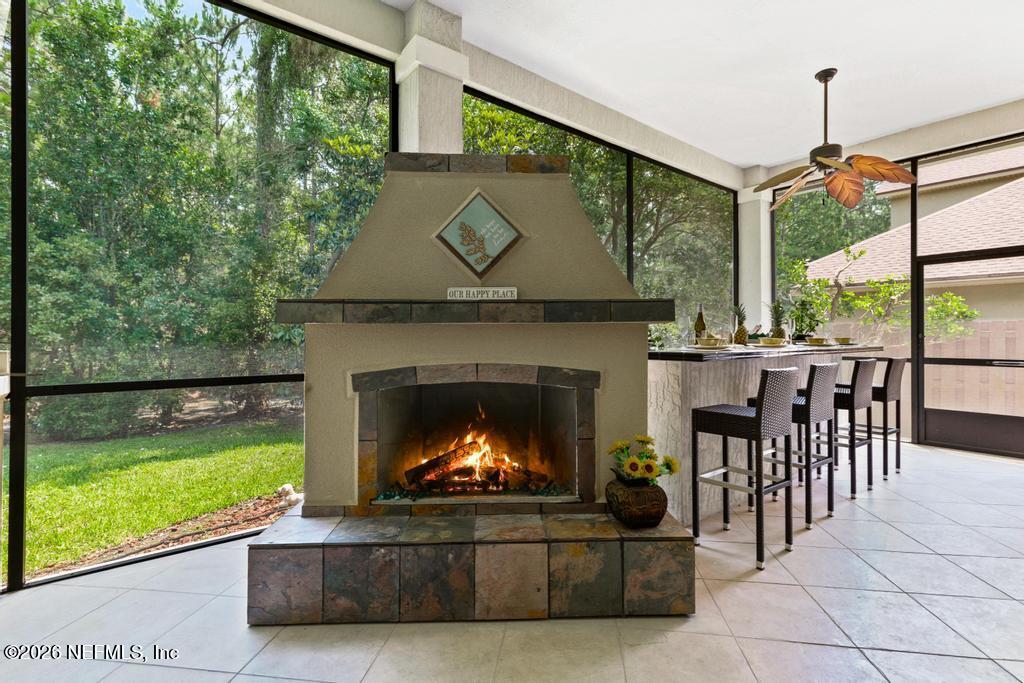 7843 Mt Ranier Drive Jacksonville, FL 32256 - Photo 79 of 116 a living room with furniture and a fireplace