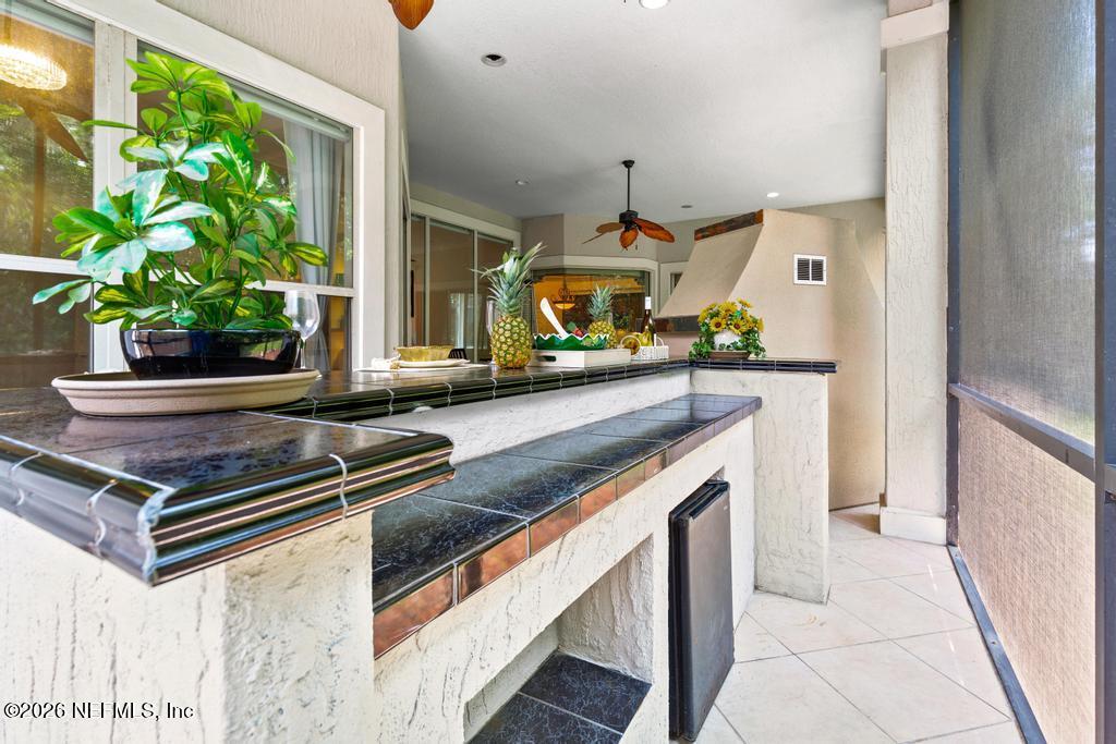 7843 Mt Ranier Drive Jacksonville, FL 32256 - Photo 82 of 116 a kitchen with stainless steel appliances granite countertop a stove a sink and a refrigerator