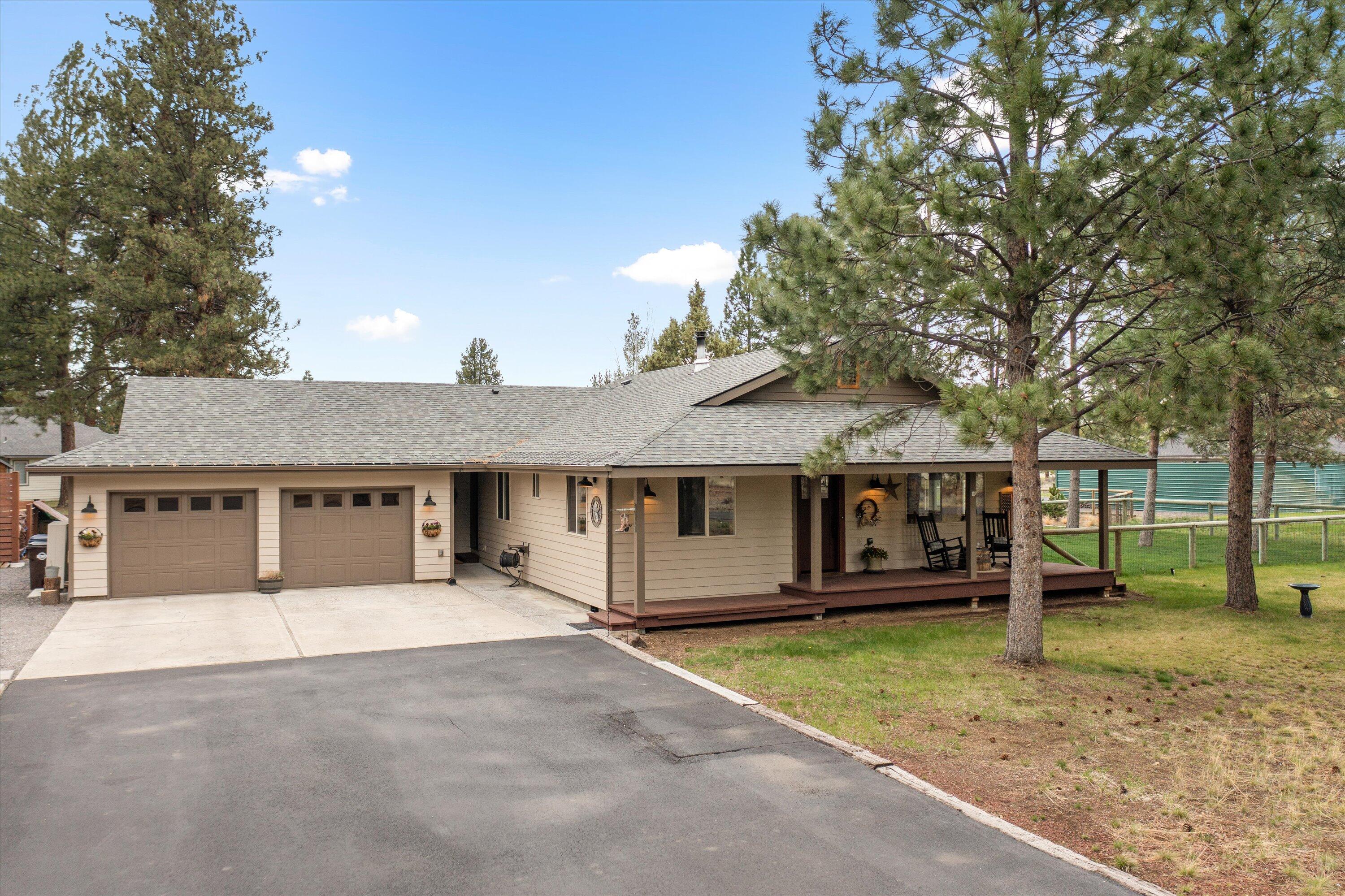 15868 Lundy Road Sisters, OR 97759 - Photo 27 of 53 front view of a house with a yard