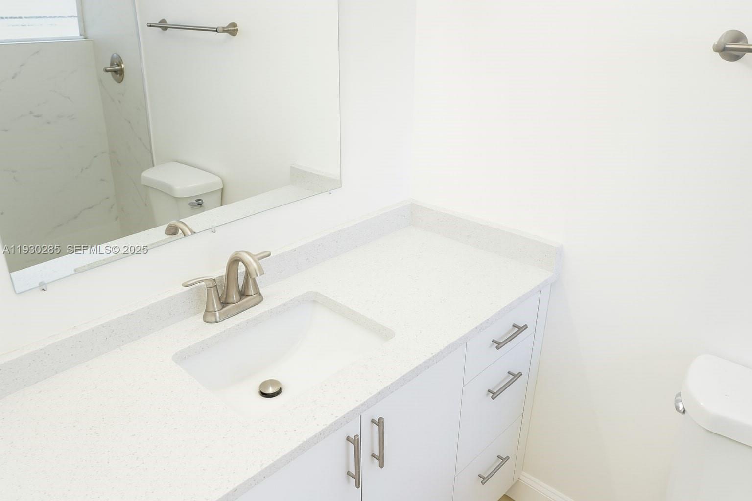 749 Southeast 15th Street, Unit 10 Fort Lauderdale, FL 33316 - Photo 11 of 16 a bathroom with a sink and a mirror