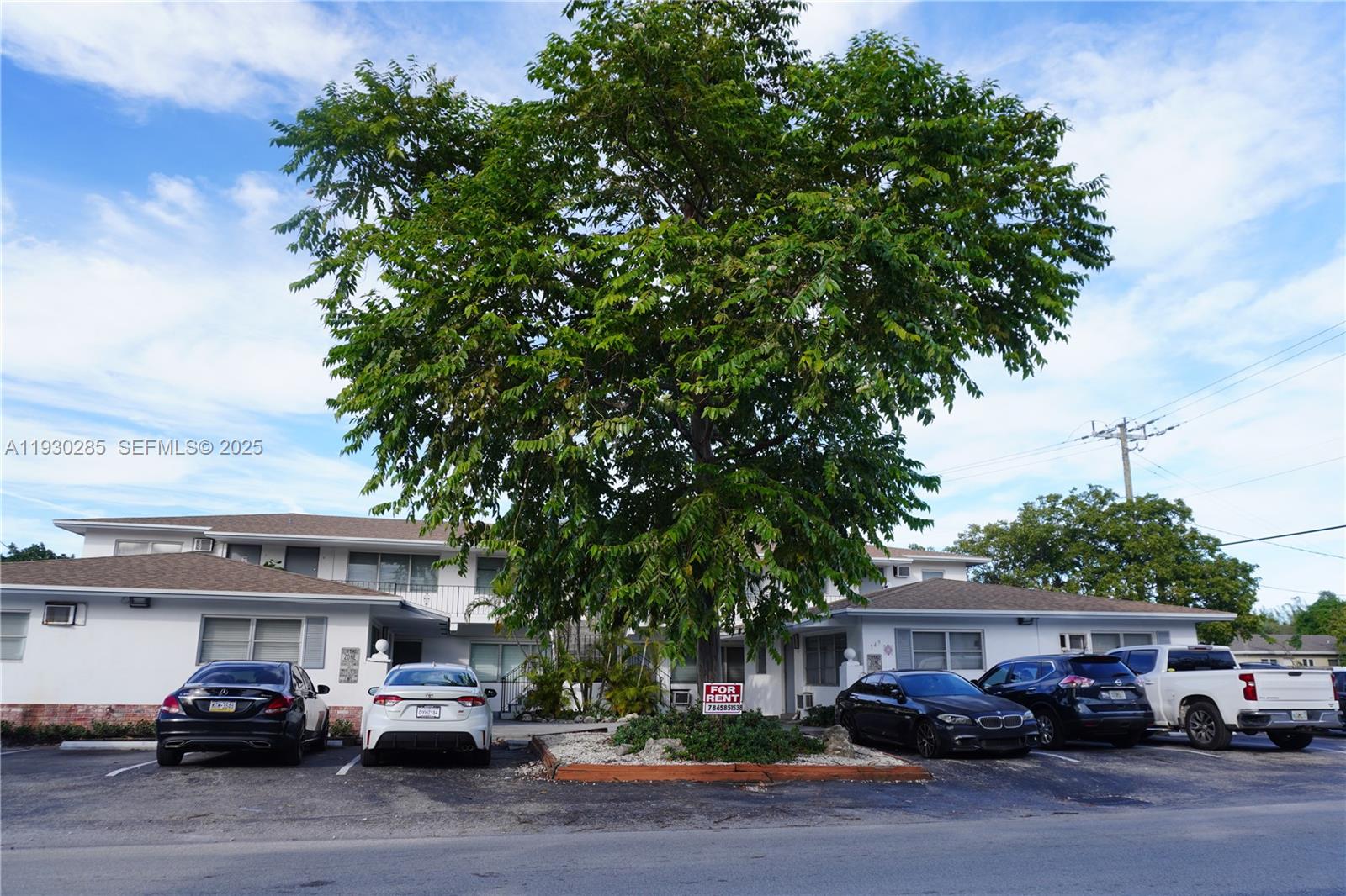 749 Southeast 15th Street, Unit 10 Fort Lauderdale, FL 33316 - Photo 13 of 16 a car parked in front of a building