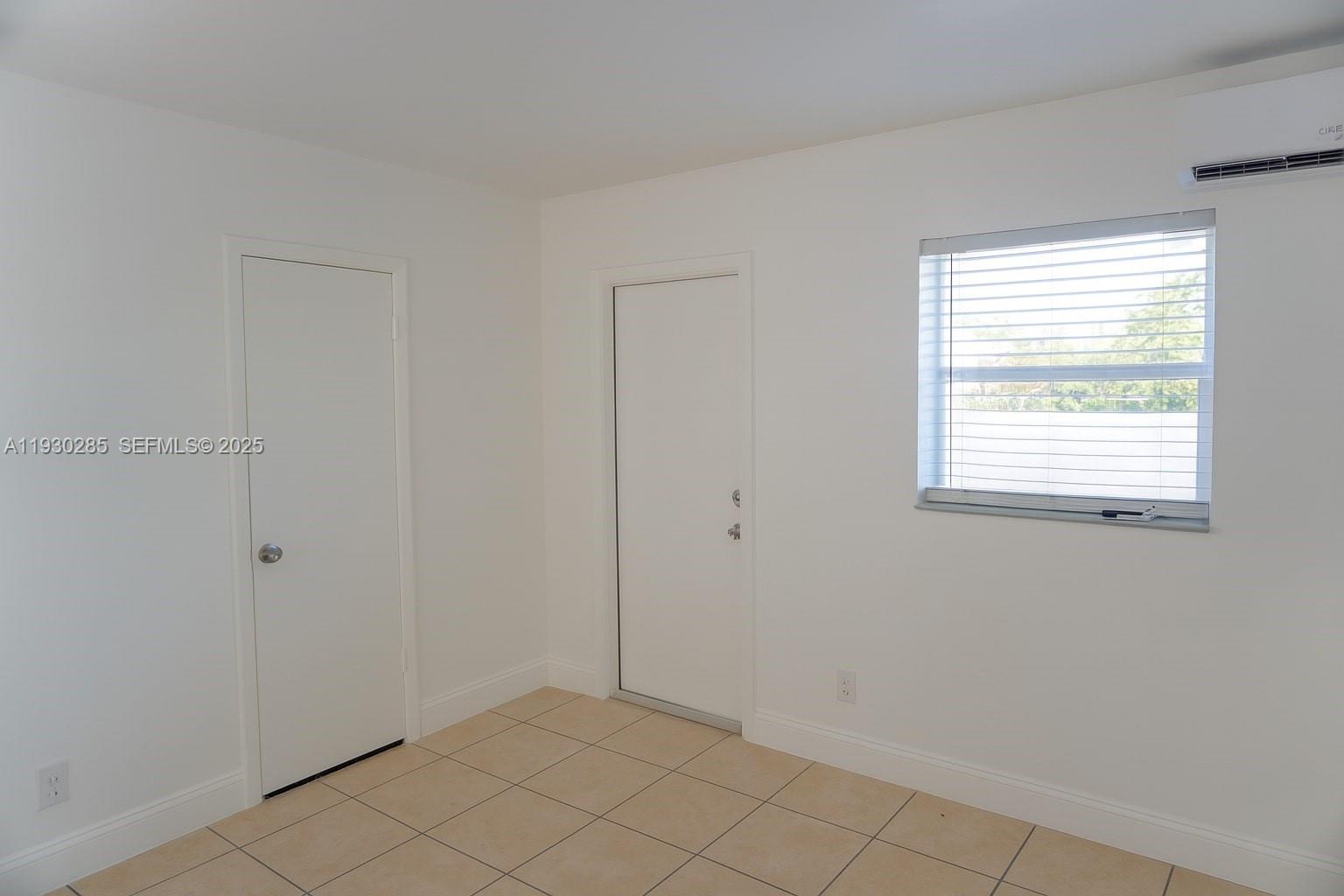 749 Southeast 15th Street, Unit 10 Fort Lauderdale, FL 33316 - Photo 8 of 16 a view of an empty room with window