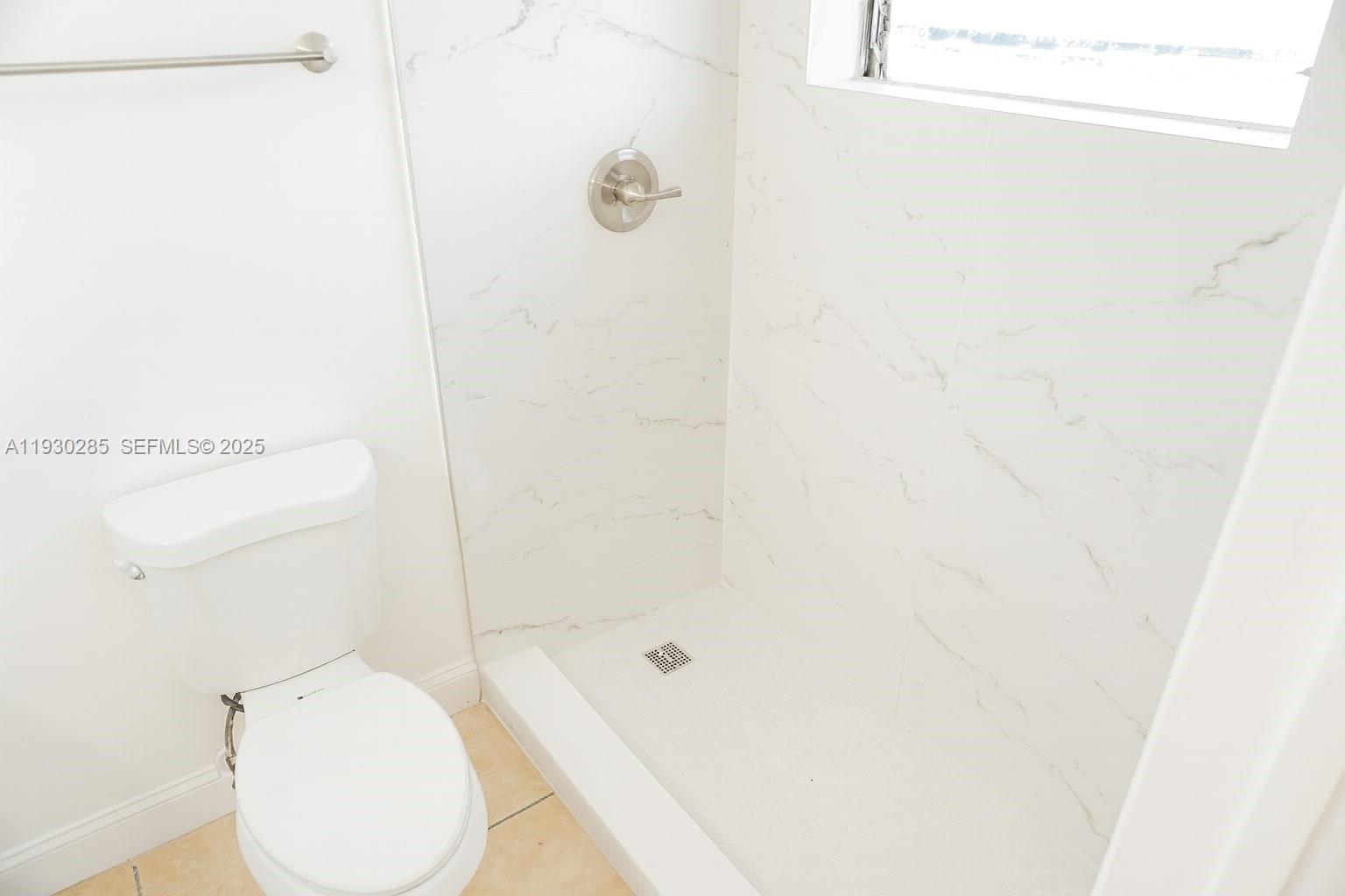 749 Southeast 15th Street, Unit 10 Fort Lauderdale, FL 33316 - Photo 10 of 16 a bathroom with a toilet and a shower