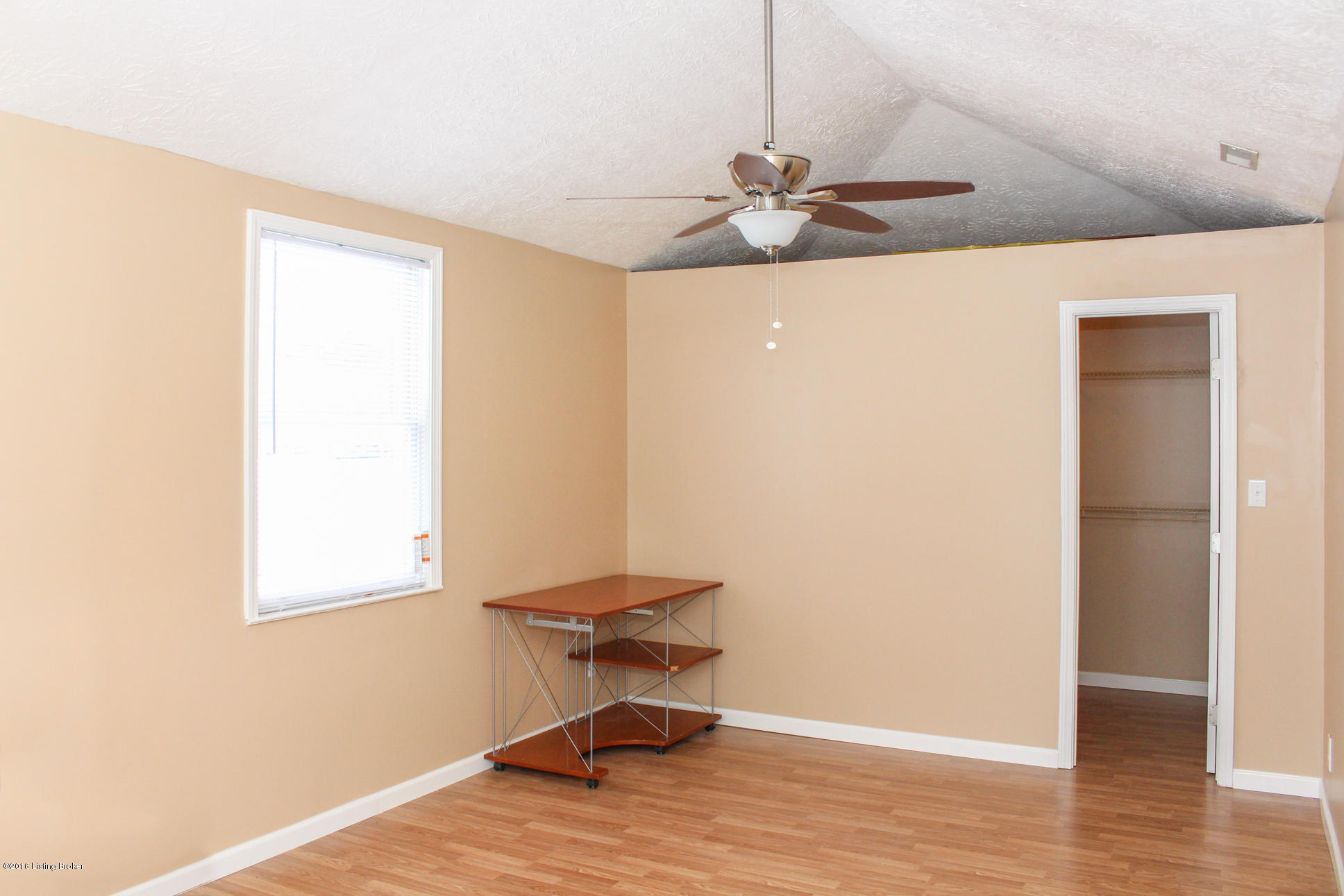 4628 Dover Road Louisville, KY 40216 - Photo 18 of 27 master bedroom with vaulted ceilings and walk in closet