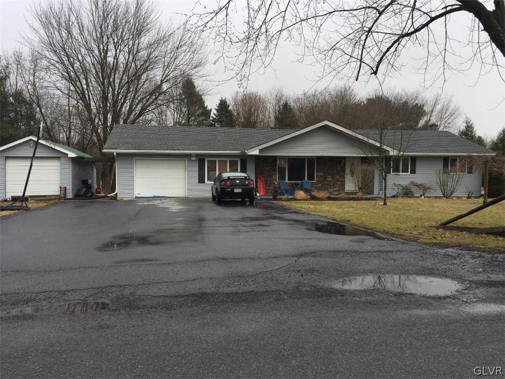 1330 Keller Road Wind Gap, PA 18091 - Photo 1 of 14 a front view of a house with a yard and large trees