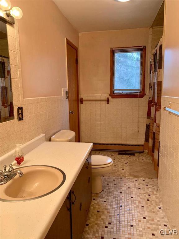 1330 Keller Road Wind Gap, PA 18091 - Photo 11 of 14 a bathroom with a sink toilet and mirror