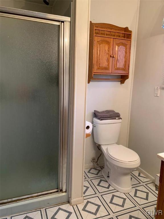 1330 Keller Road Wind Gap, PA 18091 - Photo 13 of 14 a white toilet sitting next to a bathroom sink