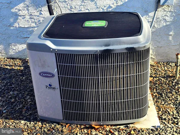 a view of an house with backyard space and balcony