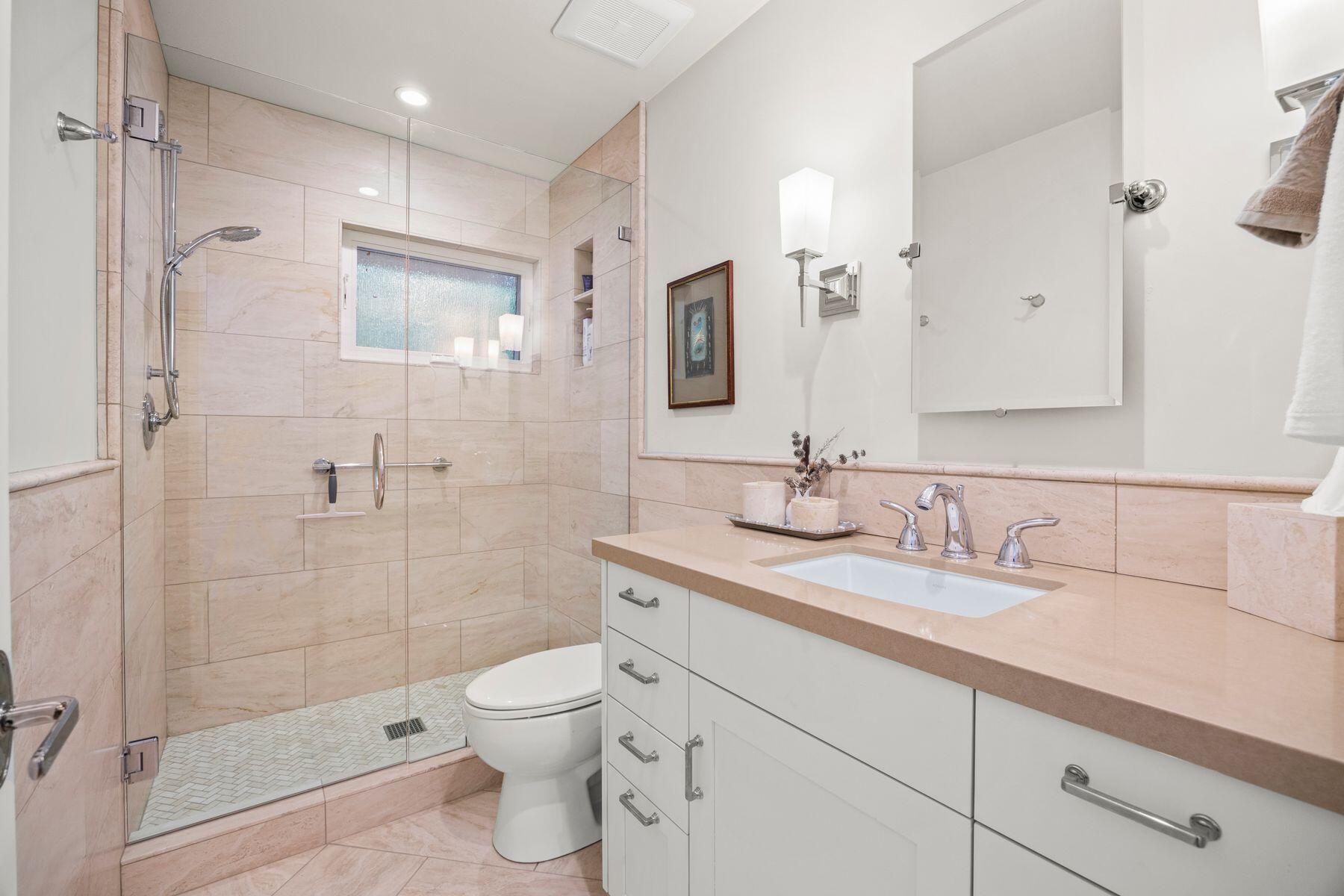 10929 Encino Drive Oak View, CA 93022 - Photo 22 of 50 a bathroom with a granite countertop toilet sink shower and mirror