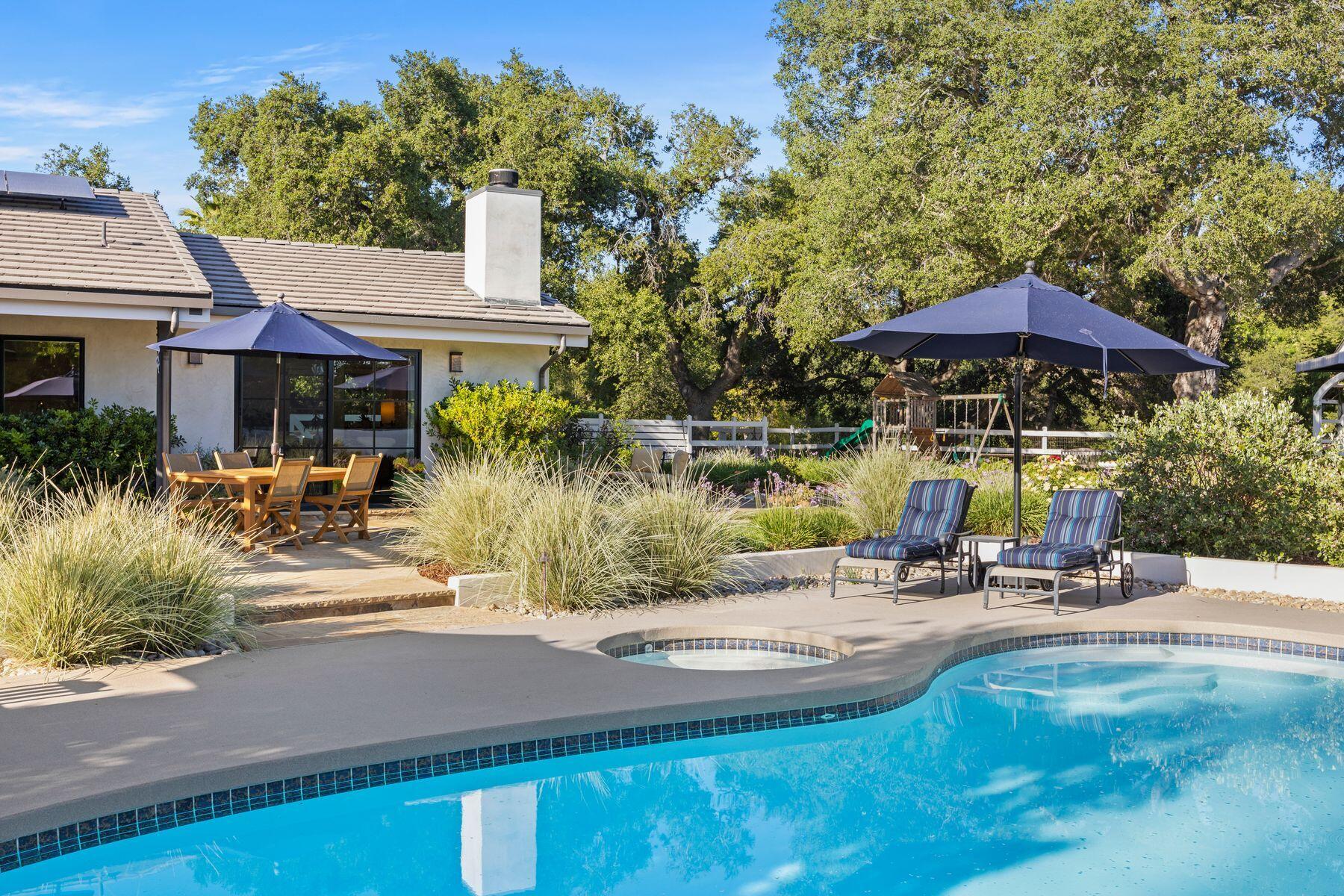 10929 Encino Drive Oak View, CA 93022 - Photo 41 of 50 an outdoor space with patio and white umbrellas